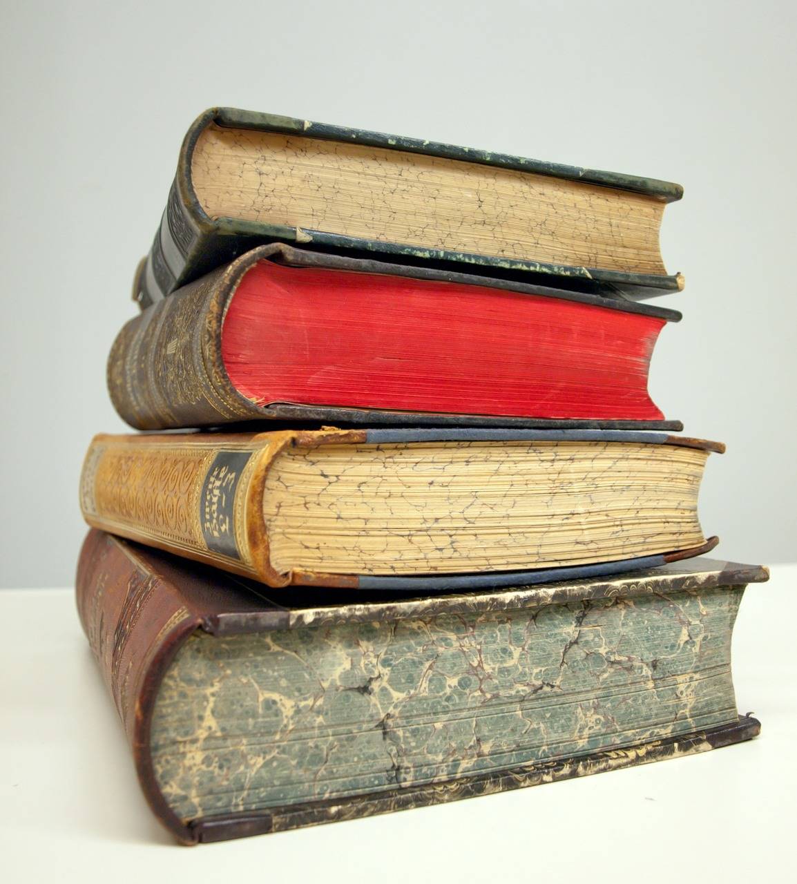 stack of hard bound books