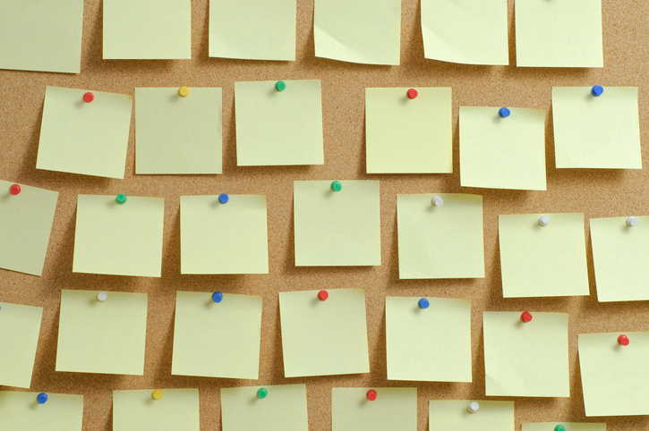 Post-its on a cork board